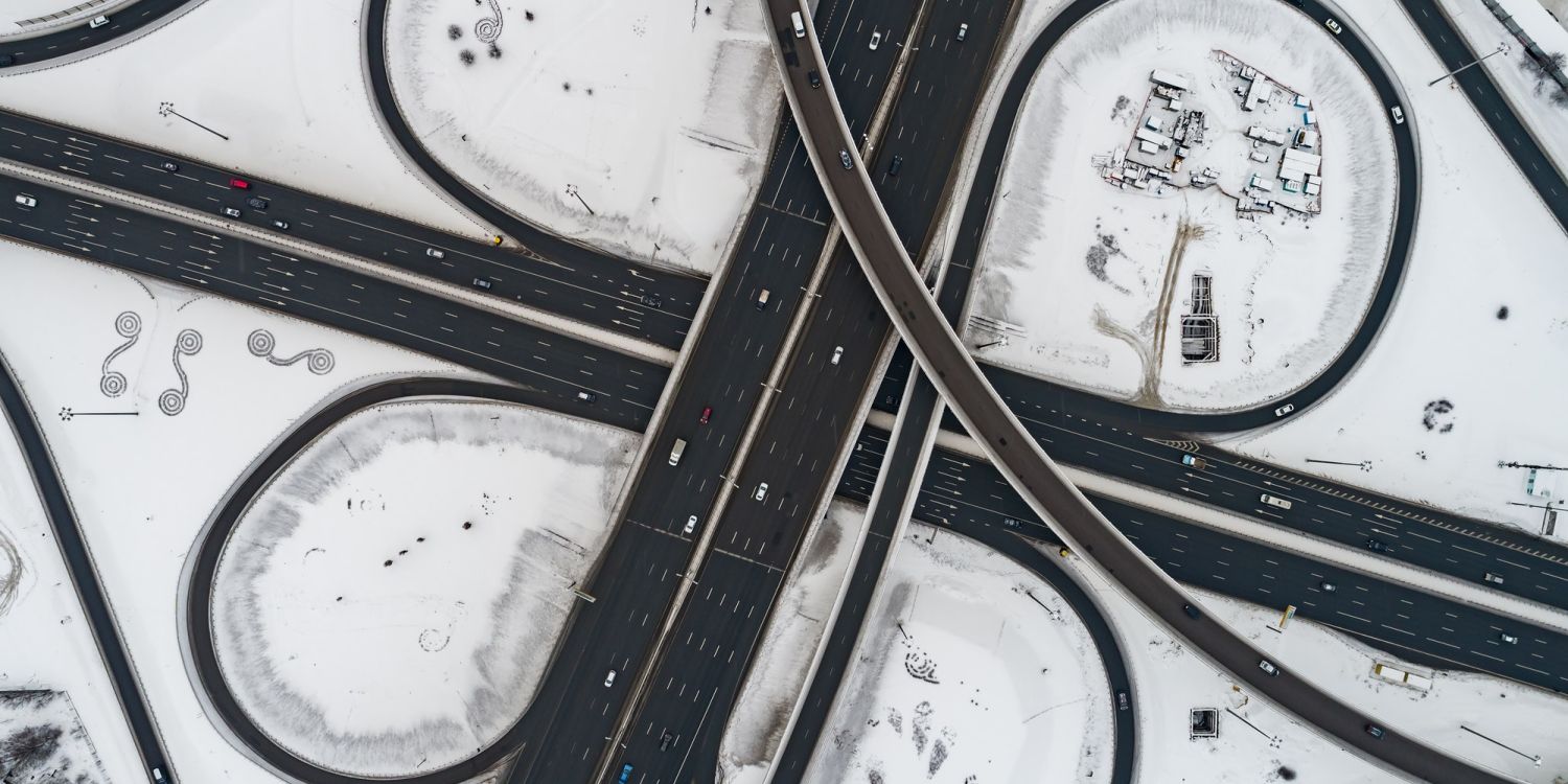 Aerial view of a freeway intersection Snow-covered in winter.